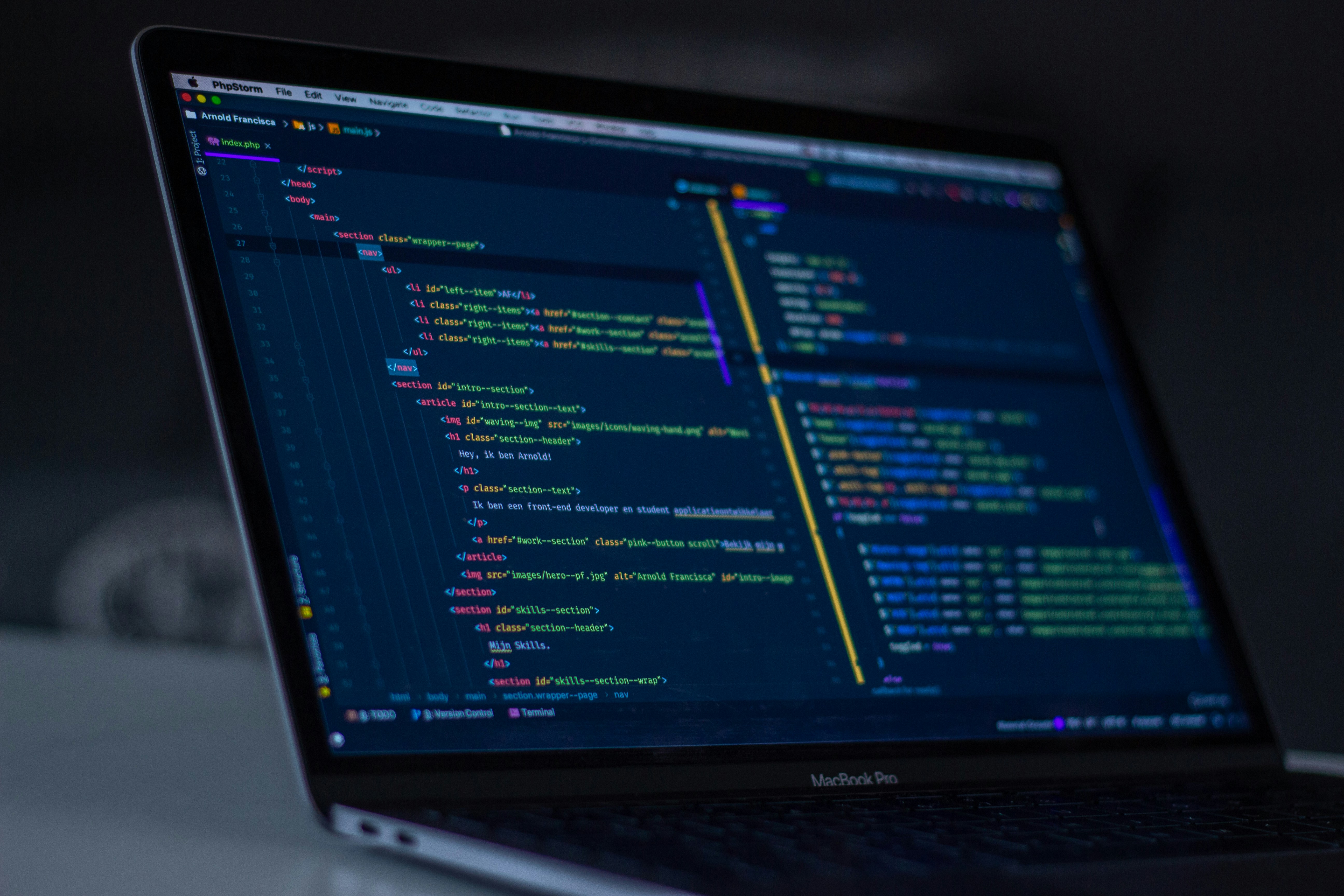 Laptop showing code in a dark IDE
